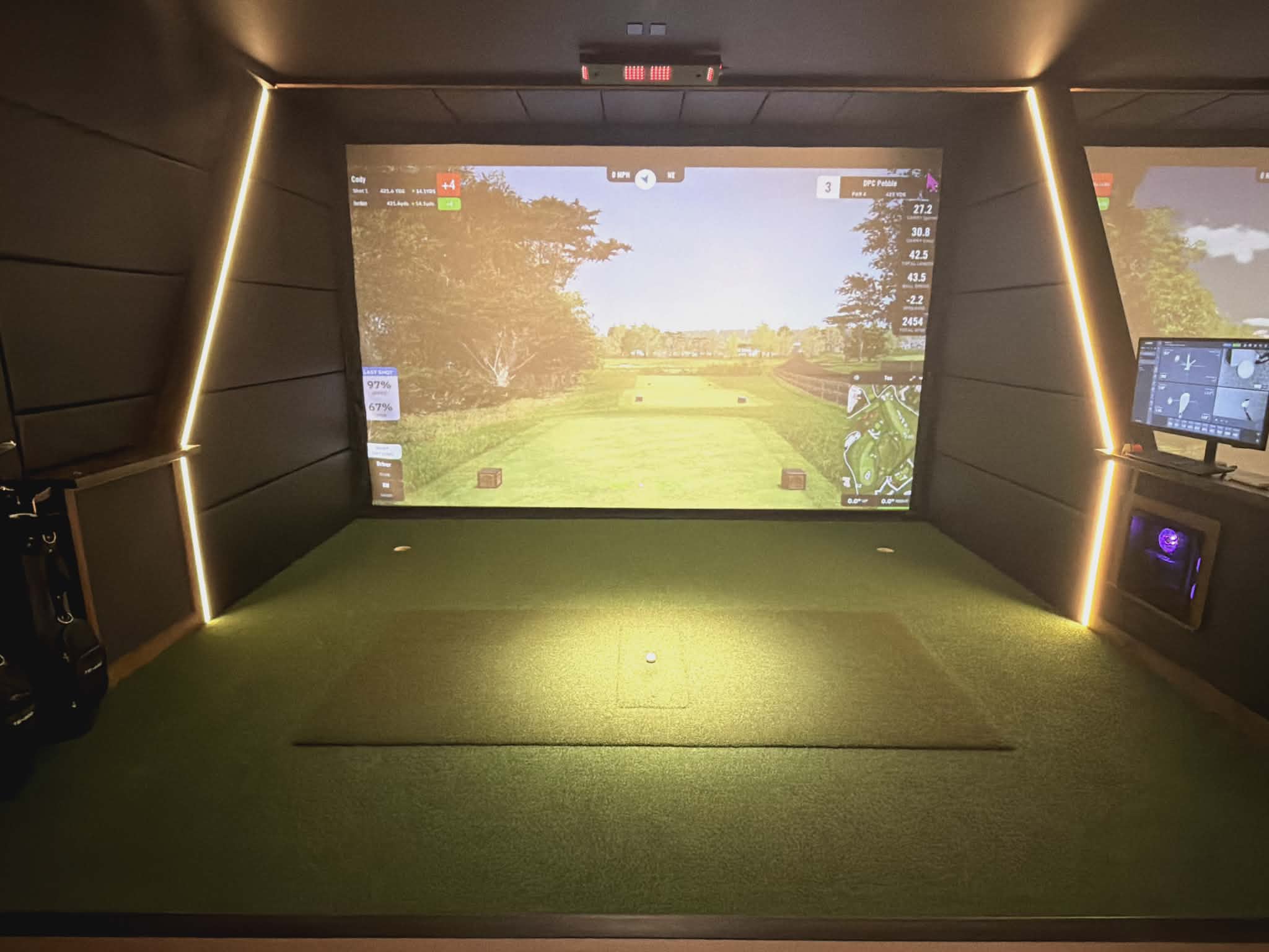 SWNG Golf Club individual simulator bay with high-definition projection screen